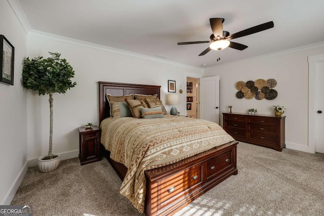 carpeted bedroom featuring ceiling fan and ornamental molding