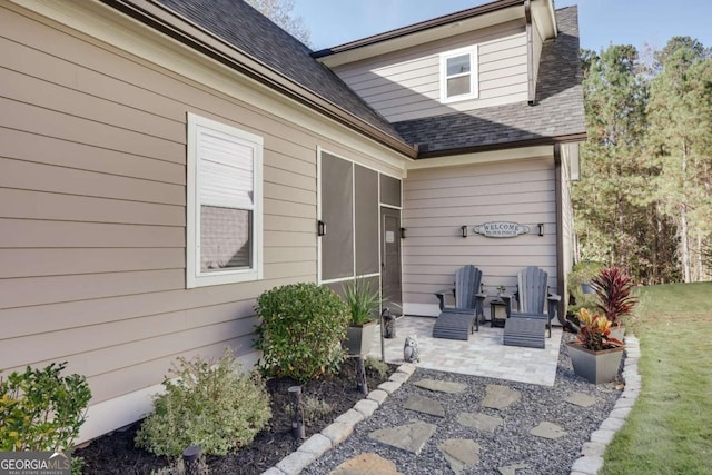 doorway to property with a patio area