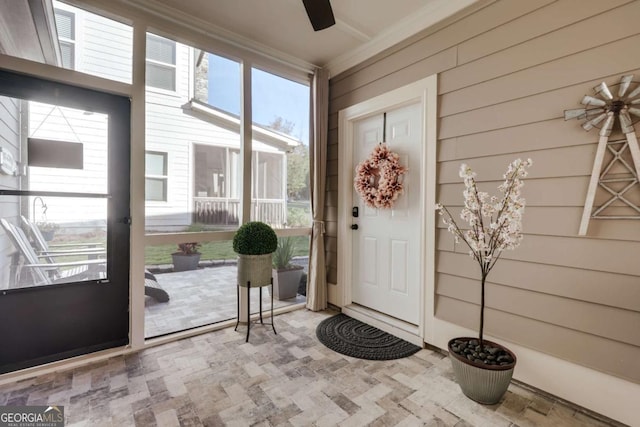 property entrance featuring ceiling fan and covered porch