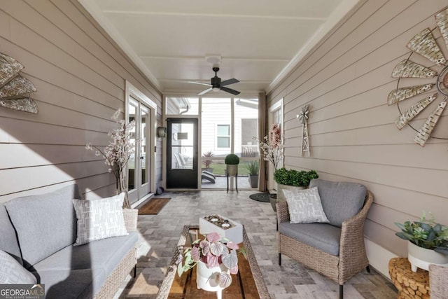 sunroom with ceiling fan