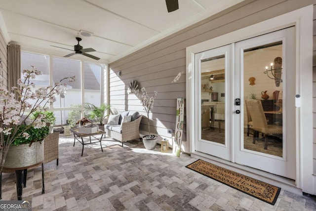 sunroom featuring ceiling fan