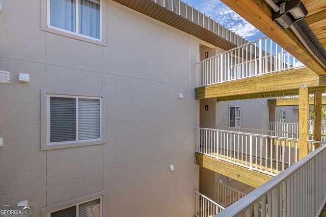 view of side of home with a balcony