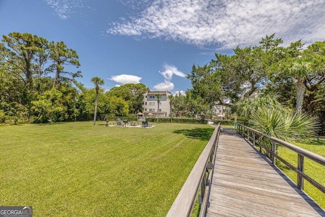 view of community featuring a lawn