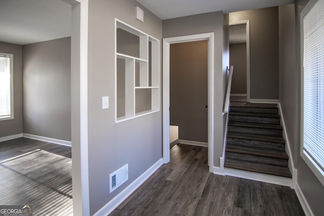 hallway featuring dark hardwood / wood-style floors