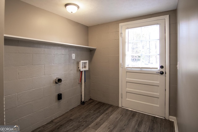 laundry room featuring electric dryer hookup, a textured ceiling, washer hookup, and dark hardwood / wood-style floors