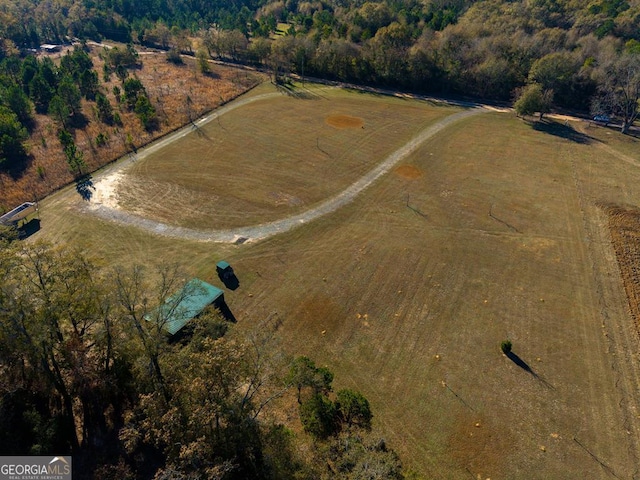 birds eye view of property with a rural view