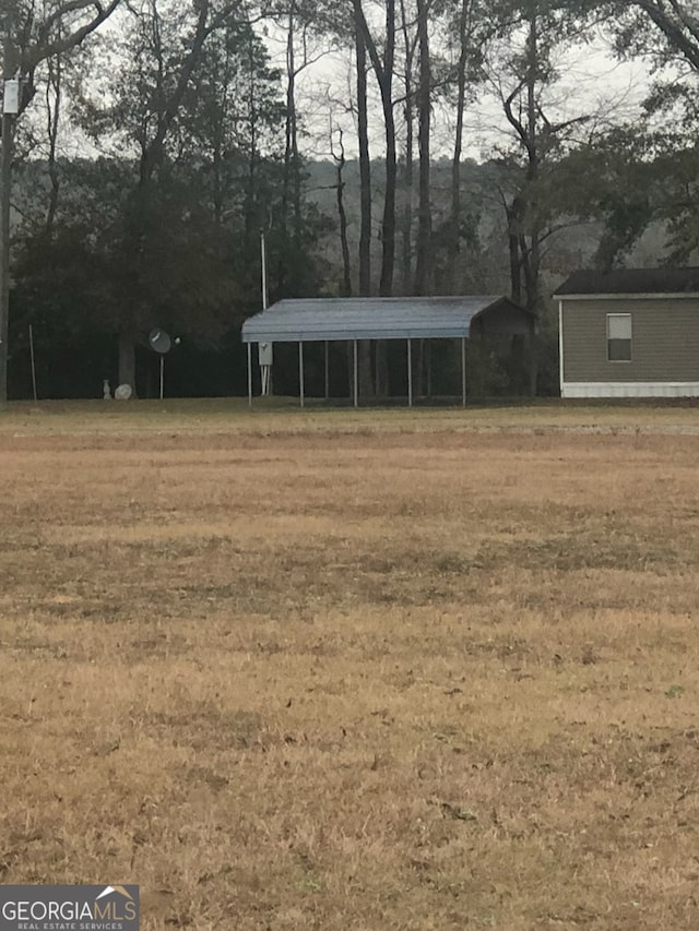 view of yard with a carport