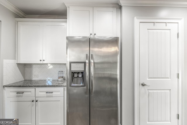 kitchen with white cabinetry, stone counters, stainless steel refrigerator with ice dispenser, decorative backsplash, and ornamental molding