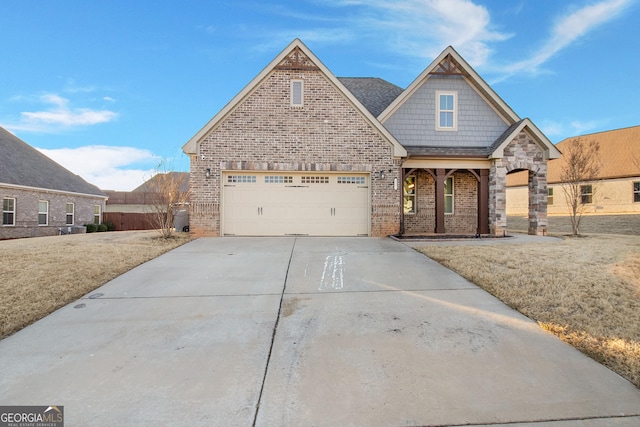 view of front of property with a front yard and a garage