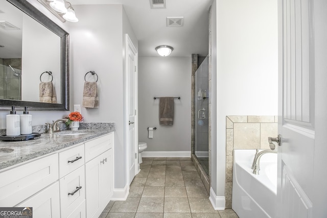 full bathroom with tile patterned floors, vanity, shower with separate bathtub, and toilet