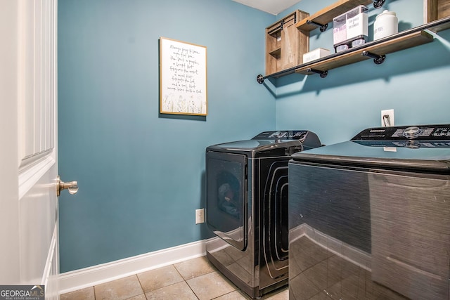 laundry room with light tile patterned floors and independent washer and dryer