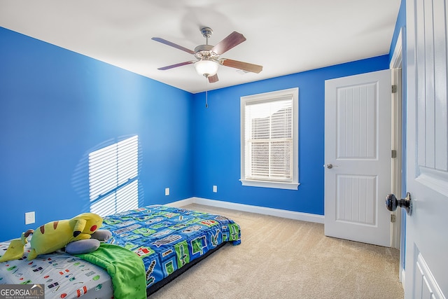 carpeted bedroom with ceiling fan