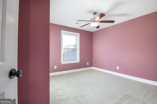 unfurnished room with carpet flooring and ceiling fan