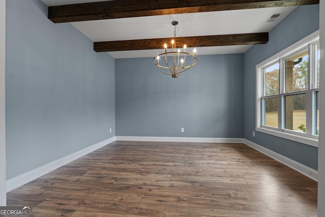 spare room featuring beam ceiling, dark hardwood / wood-style flooring, and a chandelier