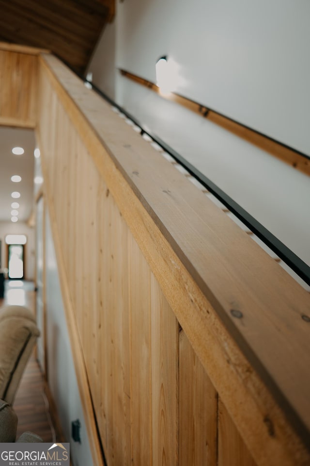 stairway with wood walls