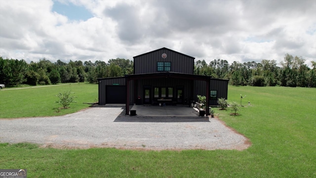 view of outbuilding featuring a yard and a garage