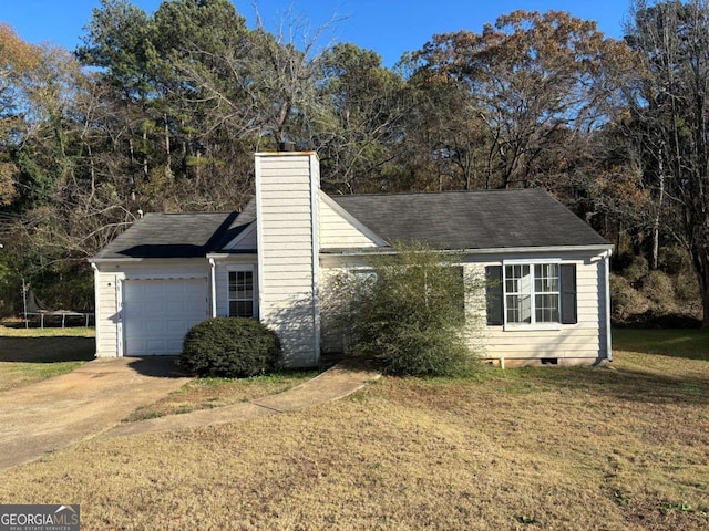 view of front facade featuring a front lawn and a garage