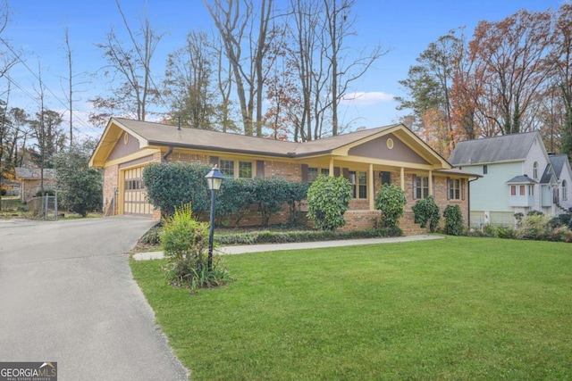 single story home featuring a front yard and a garage