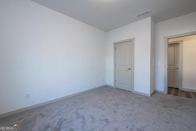 unfurnished bedroom featuring carpet