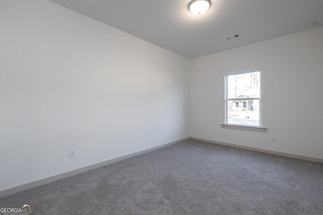 unfurnished room with carpet floors