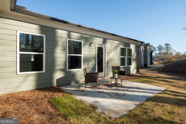 back of house with a patio area