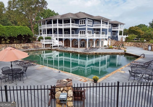 view of swimming pool with a patio area