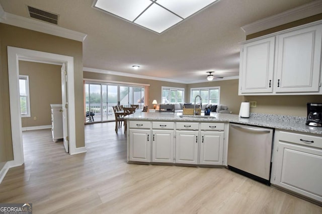 kitchen featuring kitchen peninsula, stainless steel dishwasher, sink, light hardwood / wood-style flooring, and white cabinets