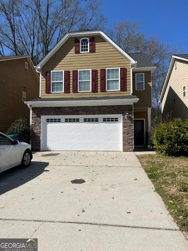 front of property with a garage