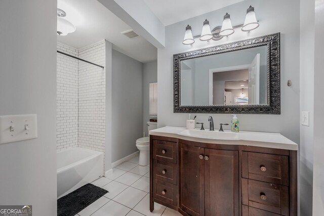 full bathroom with tile patterned flooring, vanity, toilet, and tiled shower / bath combo