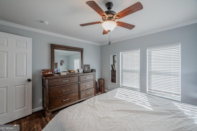 bedroom featuring ceiling fan, dark hardwood / wood-style flooring, and crown molding