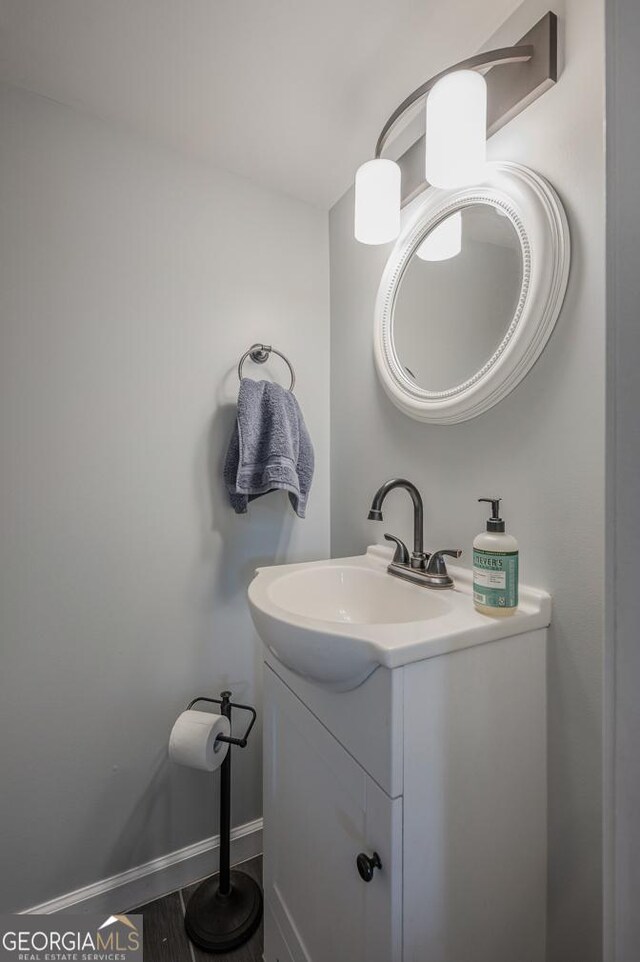 bathroom featuring hardwood / wood-style floors and vanity