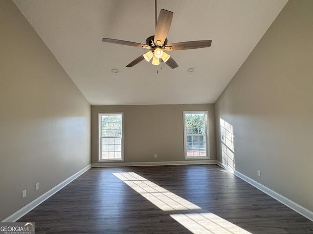 429 Deens Landing Rd, Baxley, GA 31513 - empty room featuring plenty of natural light, lofted ceiling, a ceiling fan, dark wood finished floors, and baseboards