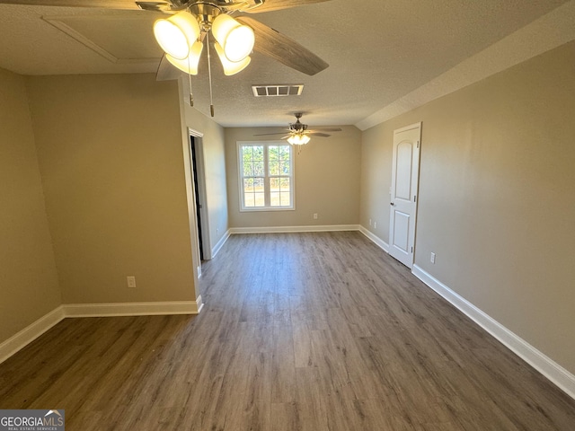 429 Deens Landing Rd, Baxley, GA 31513 - spare room with dark wood finished floors, a ceiling fan, baseboards, and a textured ceiling