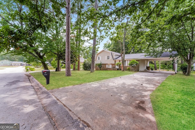 split level home with a front yard and a carport