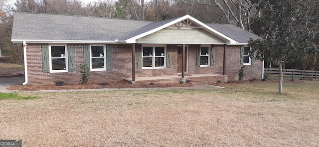 view of front facade with covered porch and a front yard