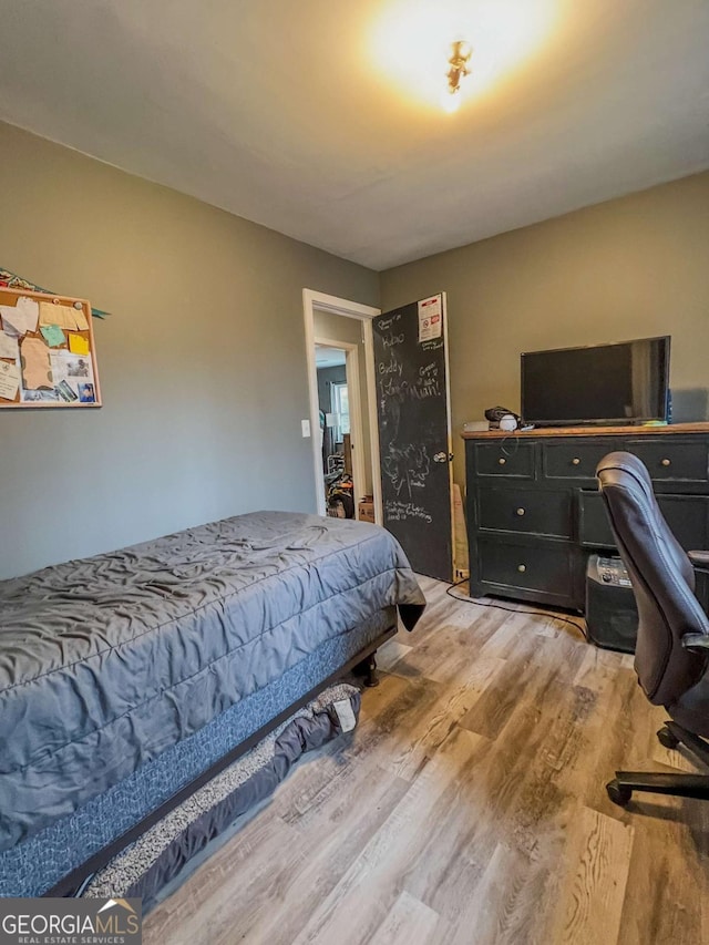 bedroom with light hardwood / wood-style flooring