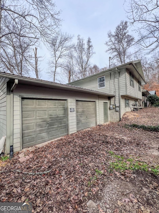 view of home's exterior with a garage