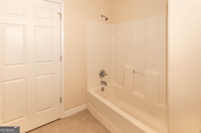 bathroom with tile patterned flooring and bathing tub / shower combination