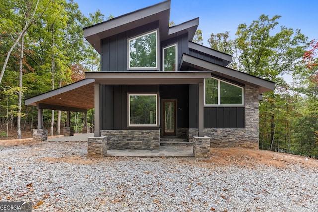 contemporary house featuring a porch