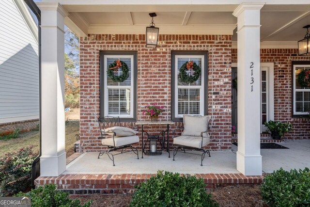 view of patio featuring a porch