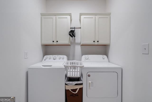 laundry area with cabinets and washer and dryer