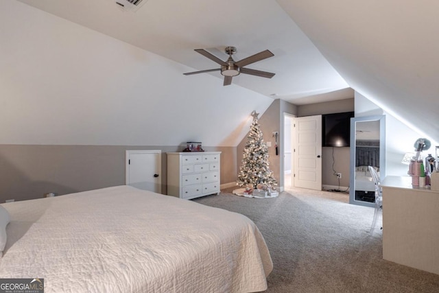 bedroom featuring vaulted ceiling, carpet floors, and ceiling fan