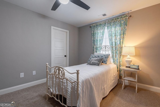 bedroom featuring ceiling fan and carpet