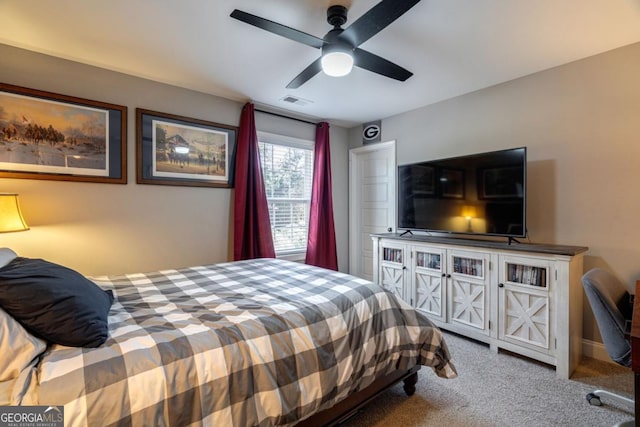 carpeted bedroom with ceiling fan