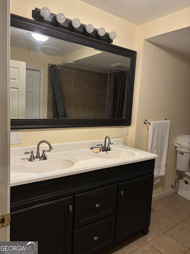 full bath with tile patterned flooring, a sink, curtained shower, and double vanity