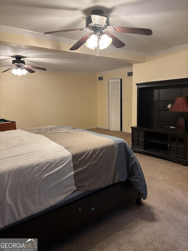 carpeted bedroom featuring ceiling fan, visible vents, and crown molding