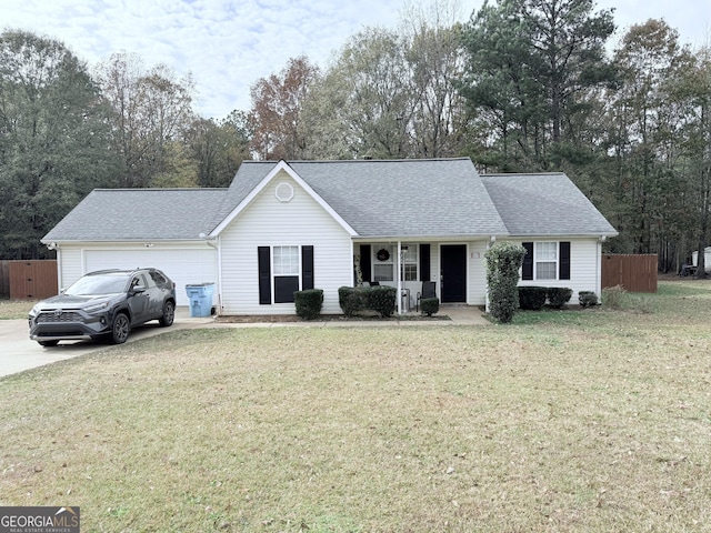 single story home with a garage and a front yard