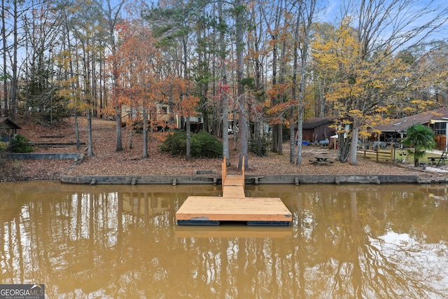 view of dock with a water view