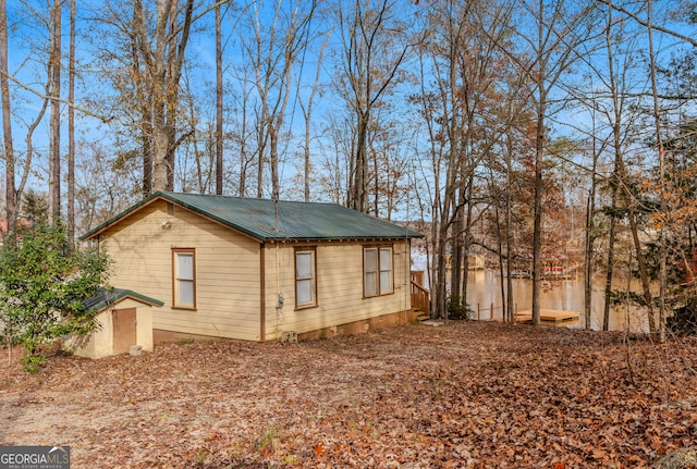 view of side of property with a shed