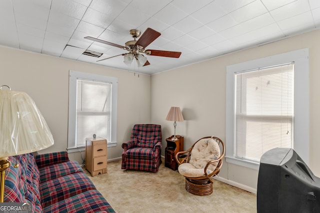 interior space featuring ceiling fan and plenty of natural light